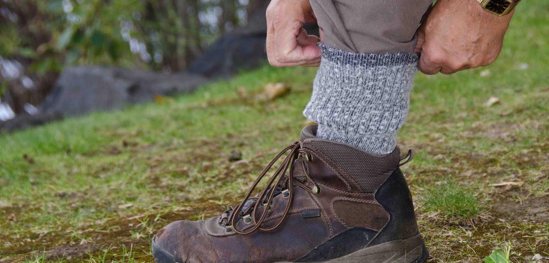 protecting against ticks by tucking pants into socks
